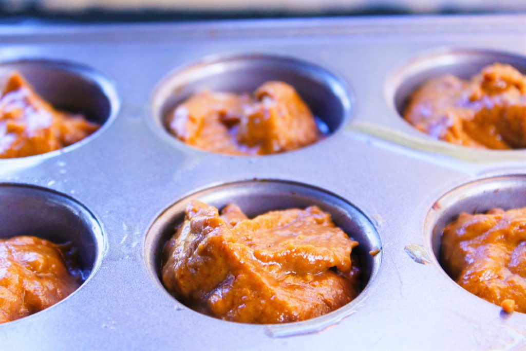unbaked perfect pumpkin muffin batter in mini muffin tin