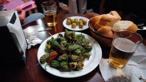 image of a plates of tapas; olives, bread