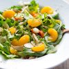 Easy Mandarin Salad Recipe by Intentionally Eat with Cindy Newland in a white bowl with a bronze spoon