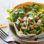image of quick & healthy taco salad by cindy newland with intentionally eat in a green bowl with a fork next to it