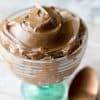 easy chocolate avocado pudding healthy dessert in a glass dish with a gold spoon