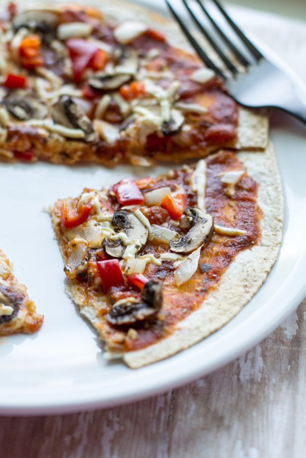 image of Crispy Healthy Tortilla Pizza by Intentionally Eat with Cindy Newland on a white plate