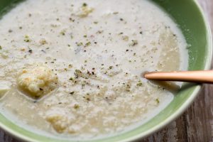 image of easy roasted cauliflower chowder by intentionally eat with cindy newland in a green bowl with a spoon