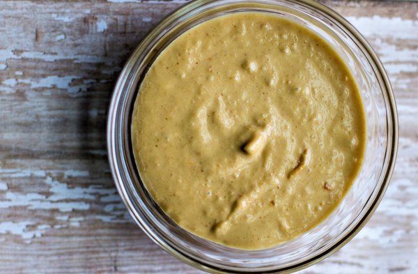 image of spicy cashew cheese sauce by intentionally eat with Cindy Newland in a glass bowl