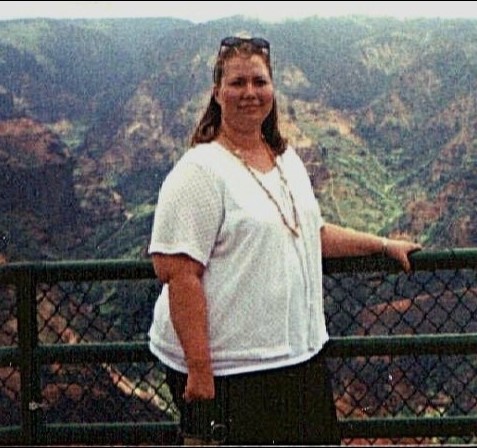 image of Cindy Newland before losing 125 pounds eating a plant based diet overlooking a canyon in Hawaii