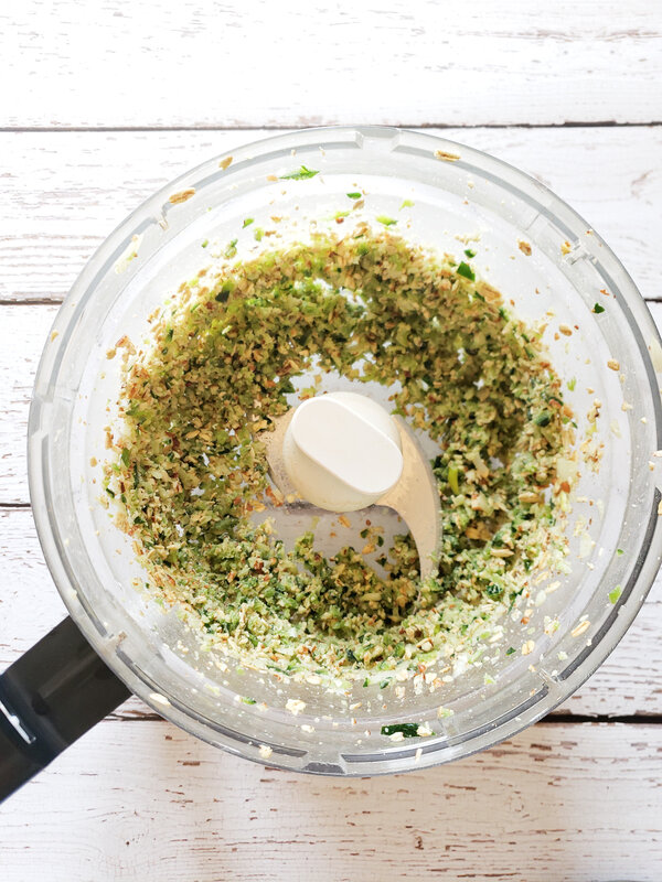 photo of poblano, onion, walnuts, oats, and spices blended together in a food processor 