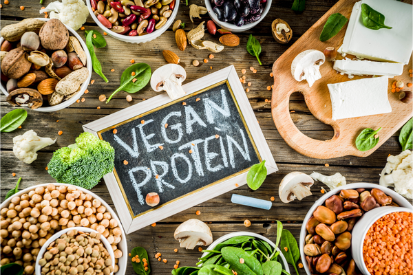 vegan proteins like beans, nuts, seeds, and vegetables to be included in a vegan grocery shopping list