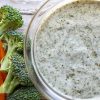 vegan ranch dressing in a glass bowl with veggies next to it