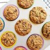 vegan zucchini bread muffins in a muffin pan on a cooling rack