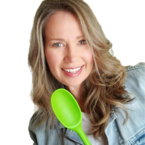 Health Coach Cindy Newland holding a green spoon for Intentionally Eat