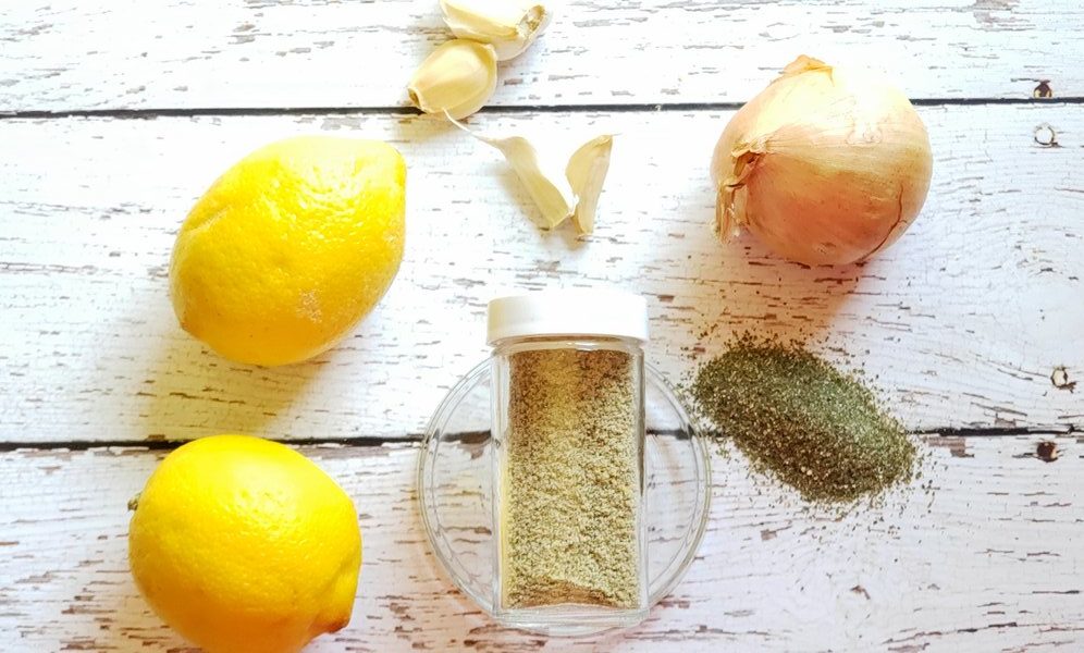 homemade salt substitute in a spice jar surrounded by ingredients
