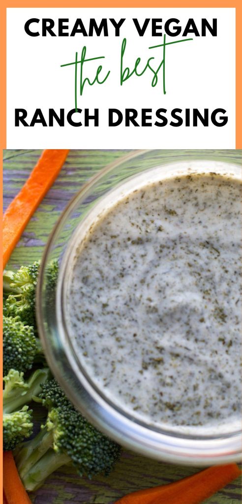 creamy vegan ranch dressing in a glass bowl with carrot sticks 