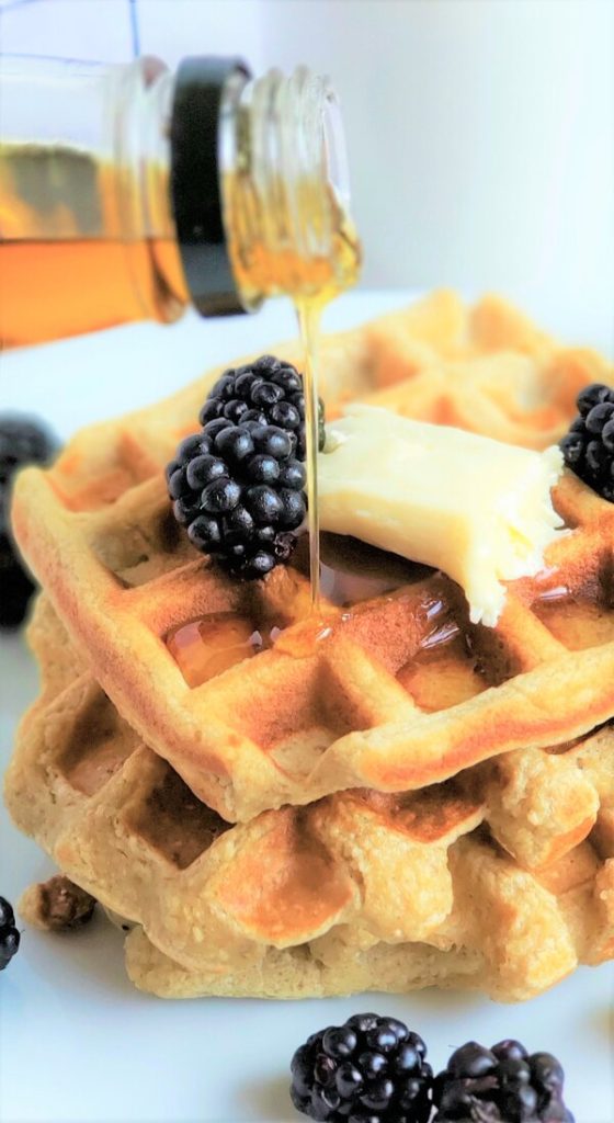 3 ingredient waffles topped with diary free butter, syrup and blackberries