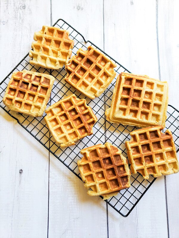 vegan waffles spread out on a cooling rack