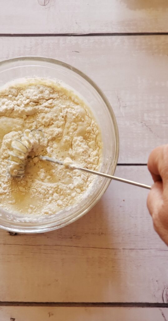 Flour added to non-dairy milk being whisked