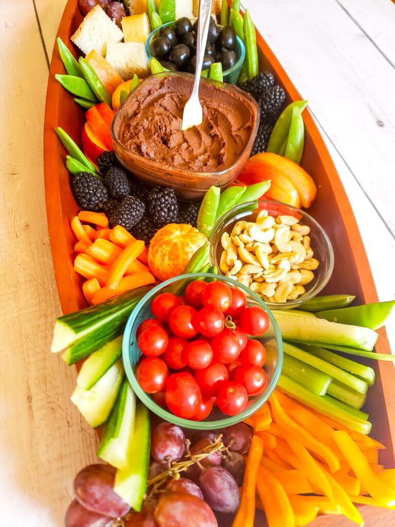 healthy charcuterie board with fruits and vegetables