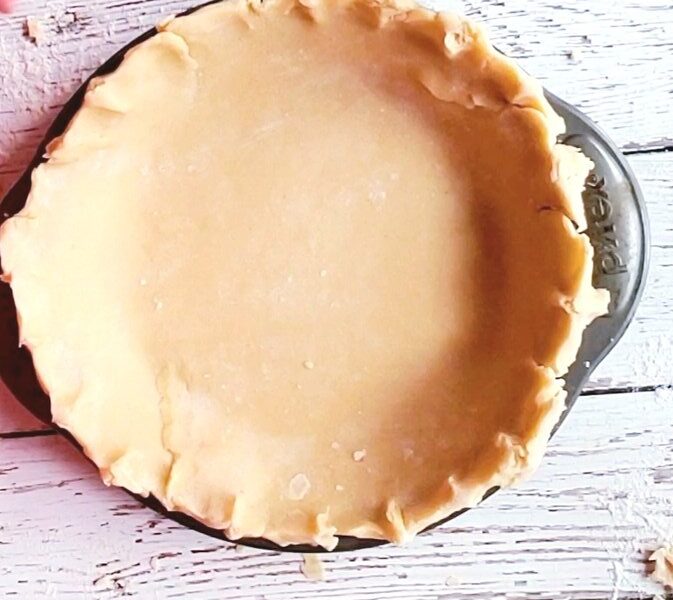 vegan pie dough in a pie plate