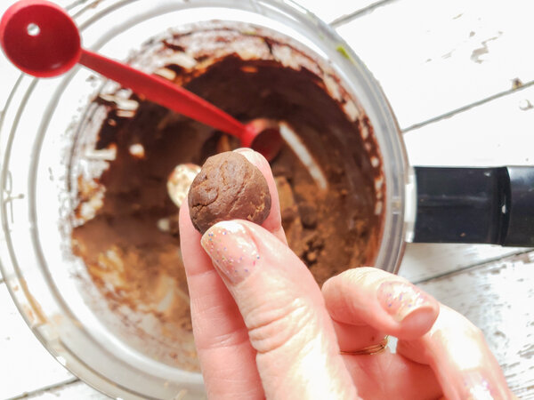 vegan chocolate truffle mixture rolled into ball