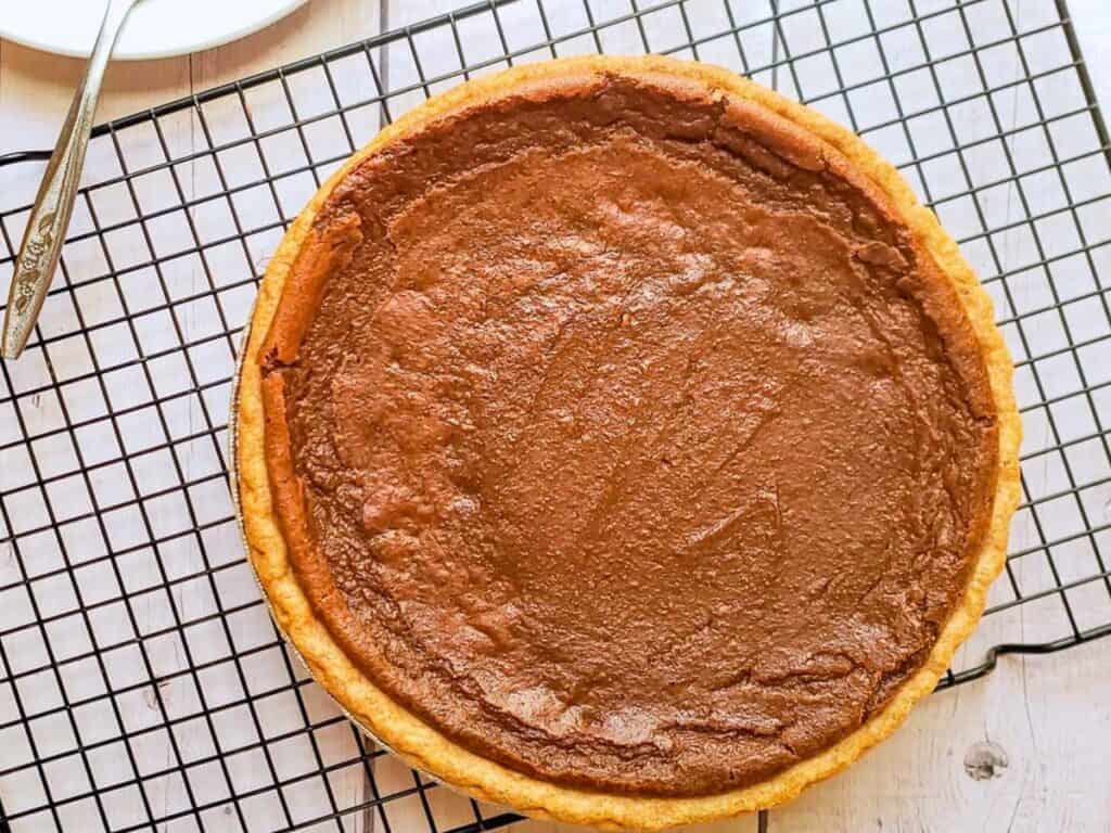 vegan sweet potato pie on a wire rack