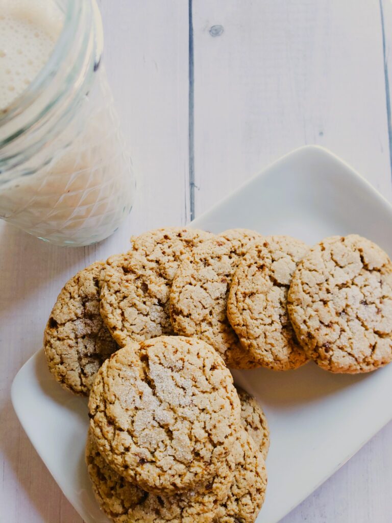 Cookies made from the recipe -Sugar free peanut butter cookie recipes on a plate with a glass of almond milk