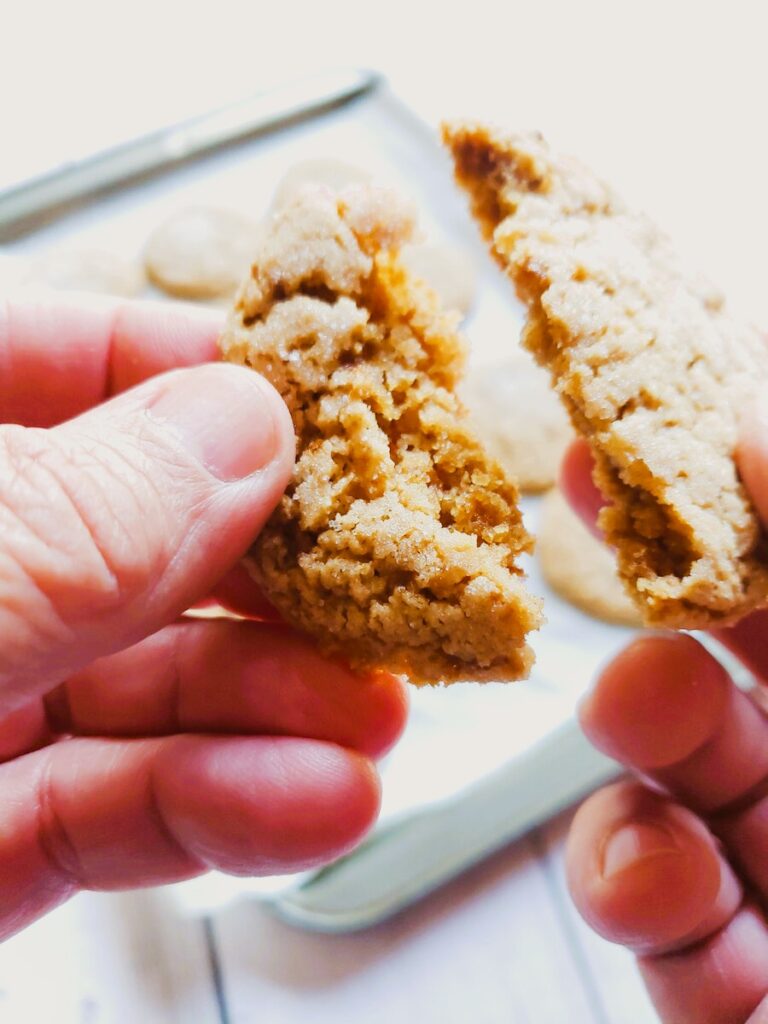 sugar free peanut butter cookie being broken in half