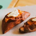 baked sweet potatoes with a pat of vegan butter