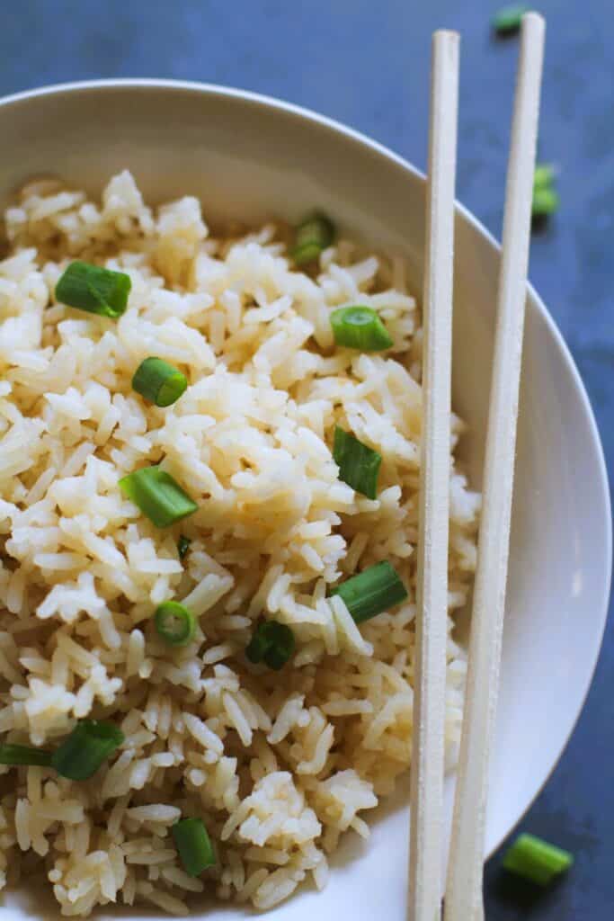 long grain rice in a bowl with chopsticks