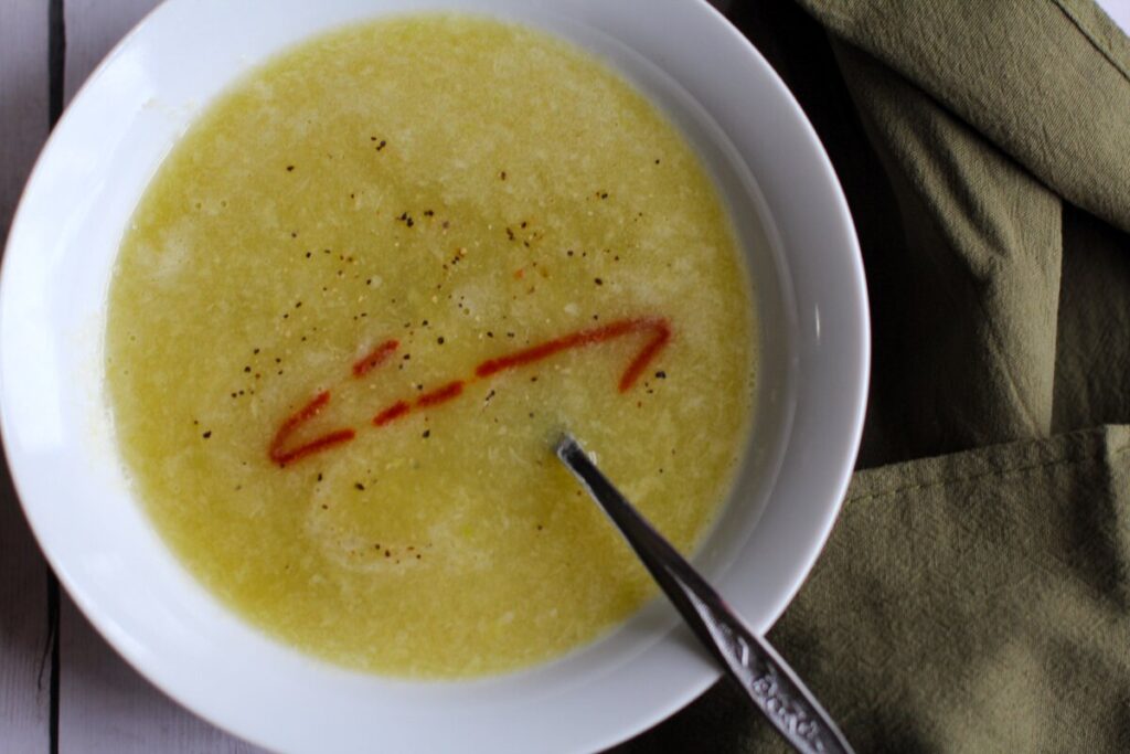 pureed leek soup in a white bowl