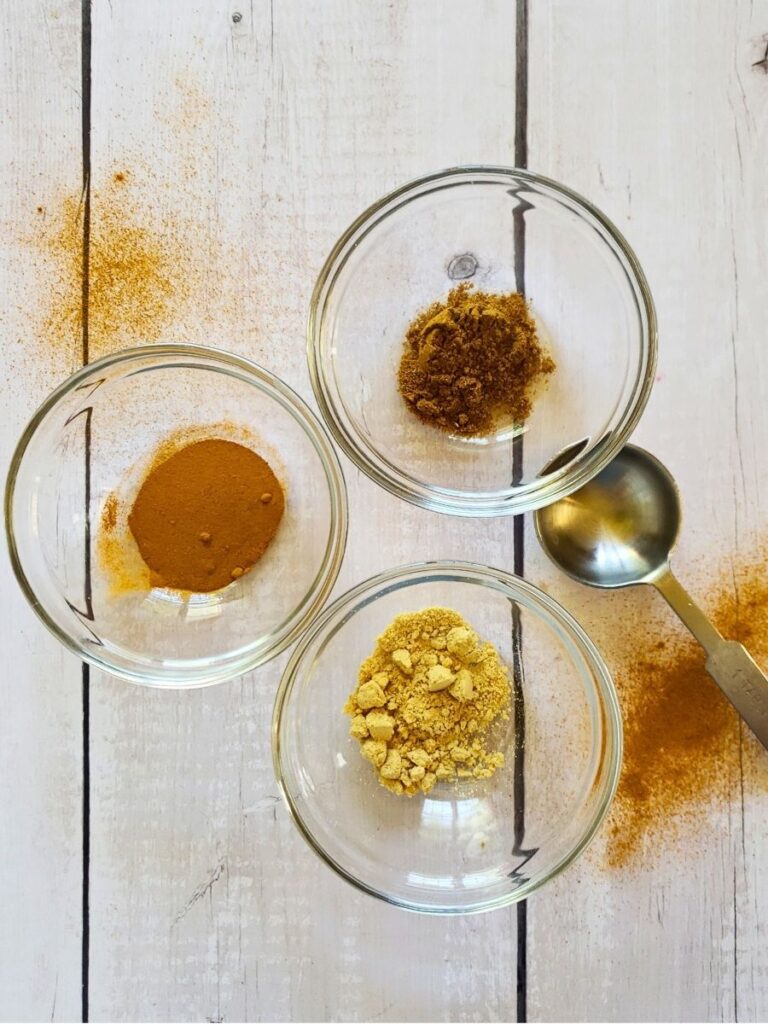 ingredients for curry powder substitute in small glass dishes