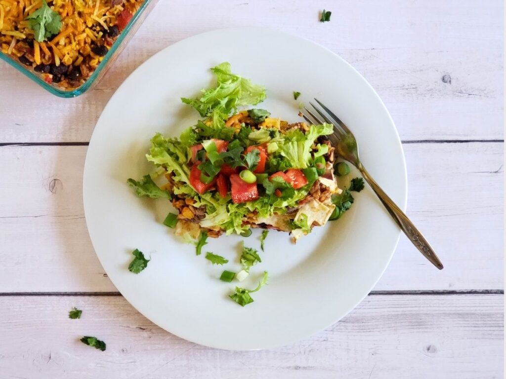 taco salad casserole on a white plate