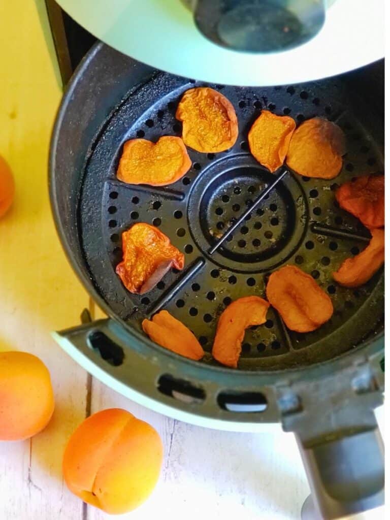 dehydrated apricots in an air fryer basket