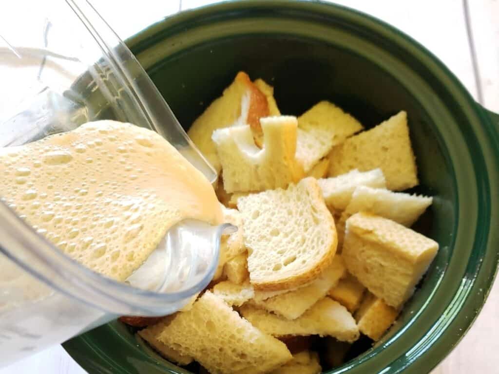 banana mixture poured over stale bread in crockpot