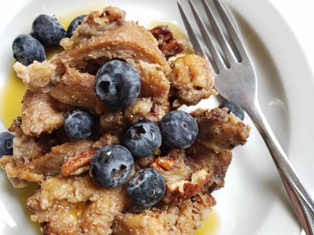 slow cooker french toast on a plate with a fork