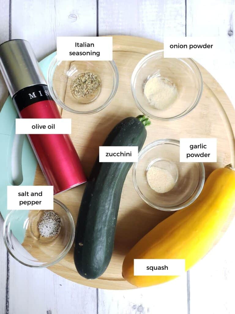 ingredients for how to cook zucchini and squash on a cutting board