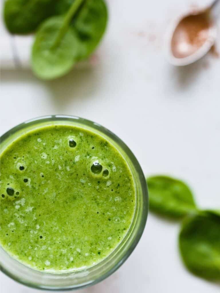 green smoothie with spinach leaves