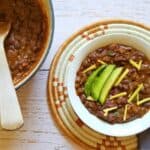 a pot and a bowl of black bean chili no tomatoes