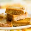pumpkin bars stacked on a plate