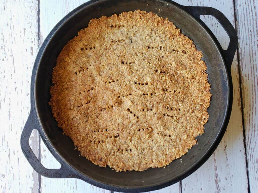crumble pie crust in a cast iron pie plate