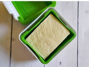 tofu being pressed