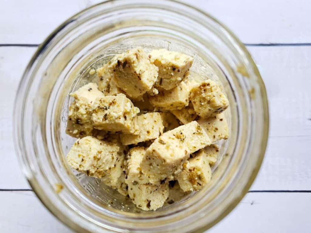 vegan feta cheese in a glass jar