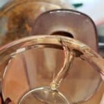 coconut oil pouring into food processor