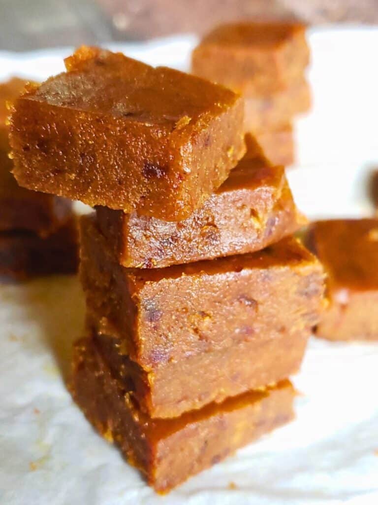 squares of pumpkin fudge stacked up