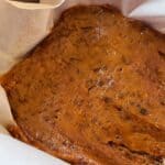pumpkin fudge pressed into a lined pan