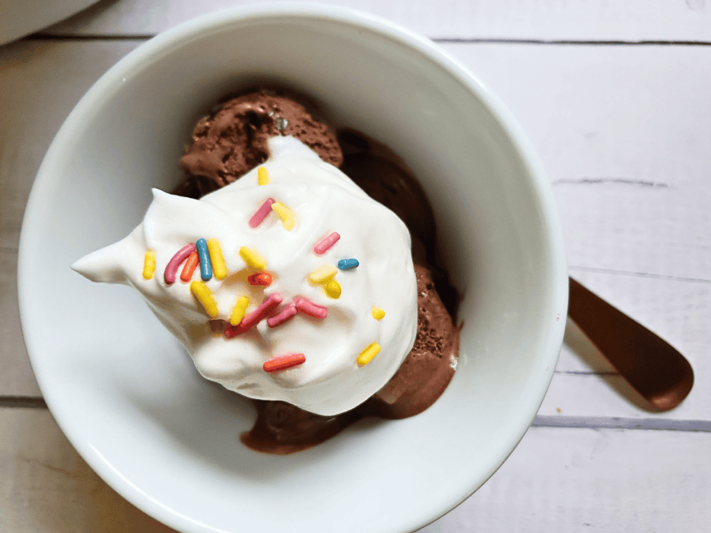 whipped coconut cream on top of ice cream