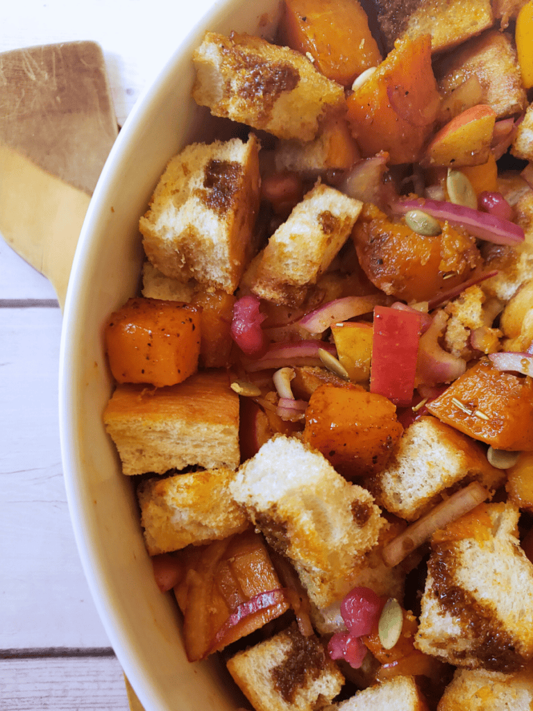 butternut squash casserole in a large white bowl