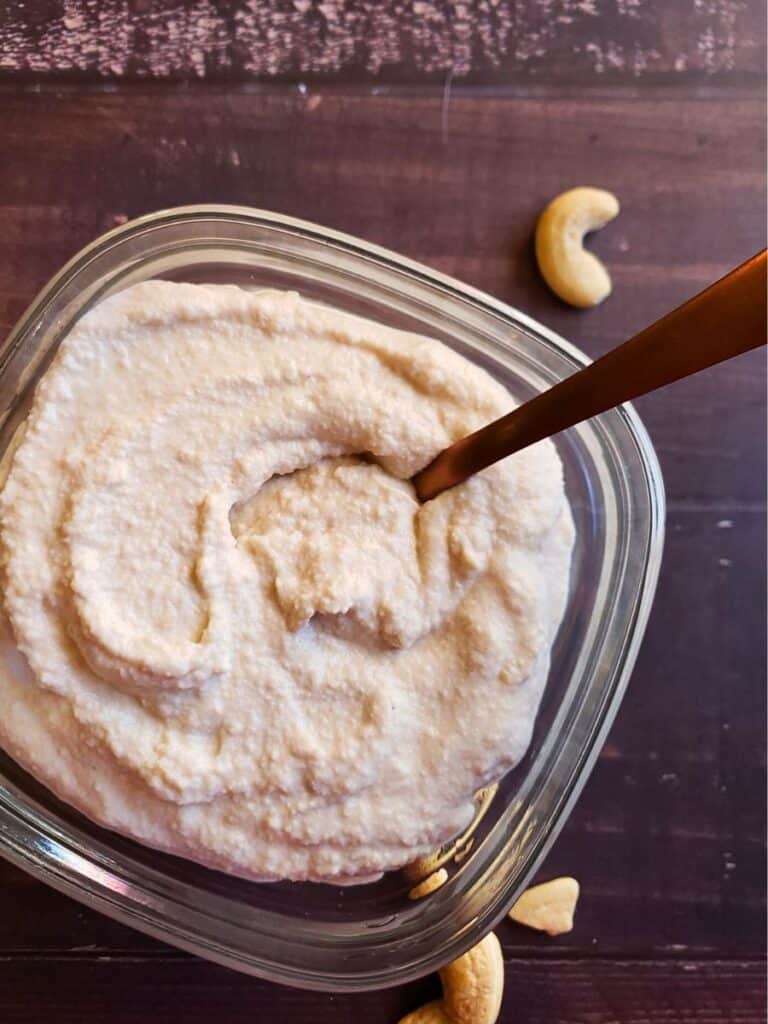 cashew cream in a small bowl with a spoon
