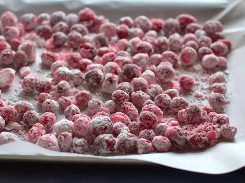 candied cranberries on parchment paper