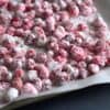 candied cranberries on a baking sheet