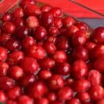 cranberries soaking in a glass ditch