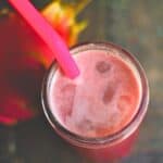 dragon fruit refresher in a glass with a pink straw